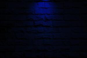 blue spot light on brick wall background photo