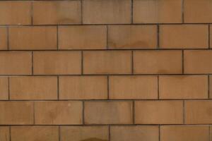 urbano marrón ladrillo pared textura en Envejecido construcción, grunge Roca modelo en sólido superficie, resumen antiguo edificio bloquear antecedentes foto