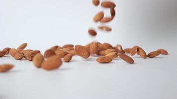 Slow motion nut almond on white background video