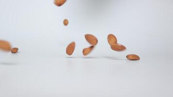 Slow motion nut almond on white background video