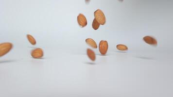 Slow motion nut almond on white background video