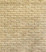 Dark brick wall pattern with chaotic masonry order. Background texture or resource for 3d texturing. Many bricks in big modern stone wall photo