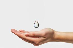 AI generated clean falling drop of water falls into hand. water resources, weather, hygiene, humidity concept photo