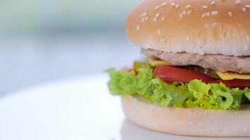 Beef Burger With Cheese Rotating Close-up. Fast Food. A Quick Snack. video