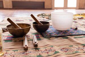 Instruments producing harmonic sounds. Tibetan and quartz singing bowls photo