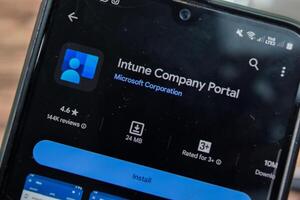 Intune Company Portal application on Smartphone screen. Intune is a freeware web browser developed by Microsoft Corporation. Bekasi, Indonesia, March 8, 2024 photo