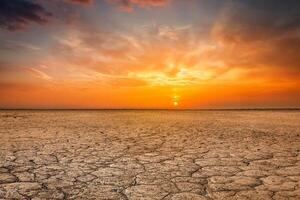 Cracked earth soil sunset landscape photo