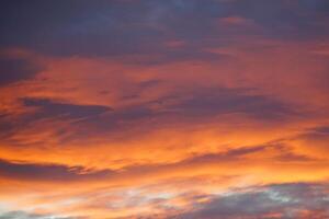 Sunset Blaze, Awe-Inspiring Sky Aglow with Orange Hues and Beautiful Clouds photo