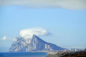 Spectacular view of the rock of Gibraltar with clouds above photo