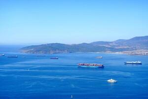 Merchandise ships at sea, arriving at port photo