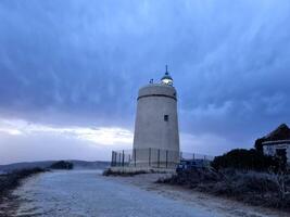 Spectacular photograph of a lighthouse at the beginning of a storm photo