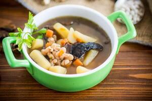 mushroom hot soup with beans in a bowl photo