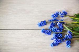 beautiful bouquet of spring flowers on a wooden table photo