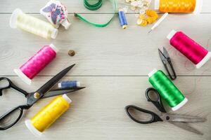 a set of tools and threads for sewing clothes photo