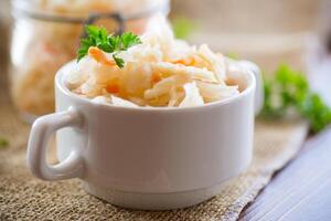 Sauerkraut with carrots and spices in a bowl photo