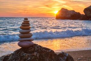 Concept of balance and harmony - stone stack on the beach photo