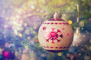 Christmas-tree decoration bauble on decorated Christmas tree bac photo