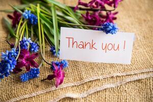 beautiful bouquet of spring flowers on a wooden table photo