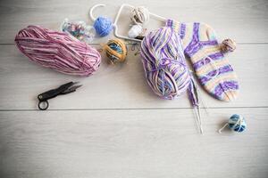 Colored threads, knitting needles and other items for hand knitting photo