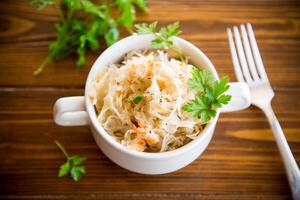 sauerkraut with carrots and spices in a bowl photo