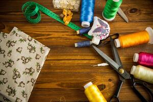 a set of tools and threads for sewing clothes photo