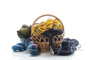 Colored threads, knitting needles and other items for hand knitting photo