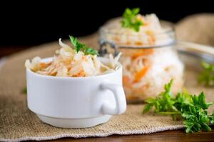 Sauerkraut with carrots and spices in a bowl photo