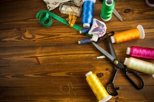 a set of tools and threads for sewing clothes photo