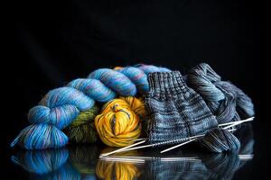 Colored threads, knitting needles and other items for hand knitting photo