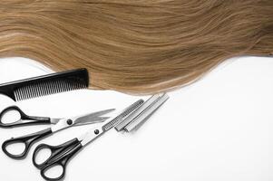 Hair and hairdresser items scissors, comb, clipper on a white background photo