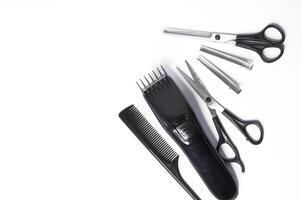 Hairdresser items scissors, comb, clipper on a white background photo