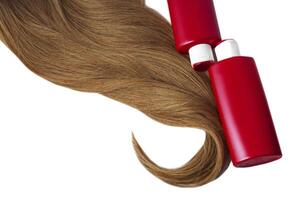 Beautiful long hair and shampoo bottles on a white background photo