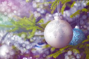 Christmas-tree decoration bauble on decorated Christmas tree bac photo