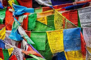 Buddhist prayer flags lungta with prayers, Ladakh photo