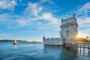 Belem Tower on the bank of the Tagus River on sunset. Lisbon, Portugal photo