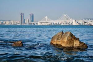 Gwangan Bridge and skyscrapers in Busan, South Korea photo