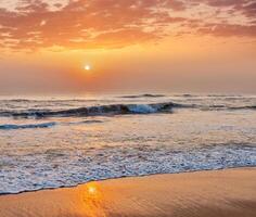 Sunrise on beach photo