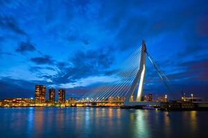 View of Erasmus Bridge Erasmusbrug and Rotterdam skyline. Rotterdam, Netherlands photo