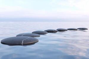 Zen stones in water photo