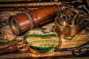 Old vintage compass on ancient map photo