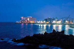 Jeju town illuminated in night, Jeju island, South Korea photo