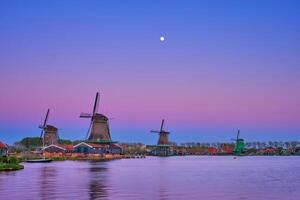 Windmills at Zaanse Schans in Holland in twilight on sunset. Zaa photo