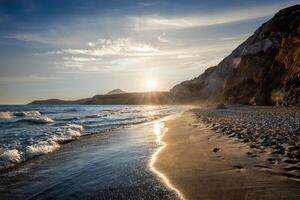 Fyriplaka beach on sunset, Milos island, Cyclades, Greece photo