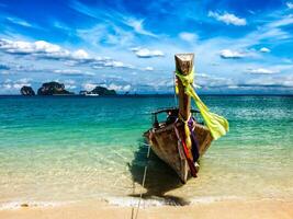 Long tail boat on beach, Thailand photo