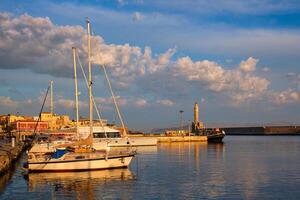 Yachts and boats in picturesque old port of Chania, Crete island. Greece photo
