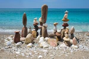 Concept of balance and harmony   pebble stone stacks on the beach photo