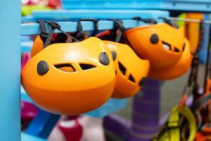 Orange Climbing Helmets on Display photo