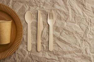 A set of disposable tableware on a paper background photo