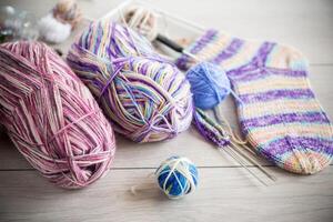 Colored threads, knitting needles and other items for hand knitting photo