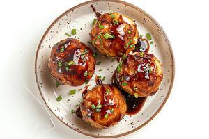 AI generated Takoyaki served on a plate isolated on a white background photo